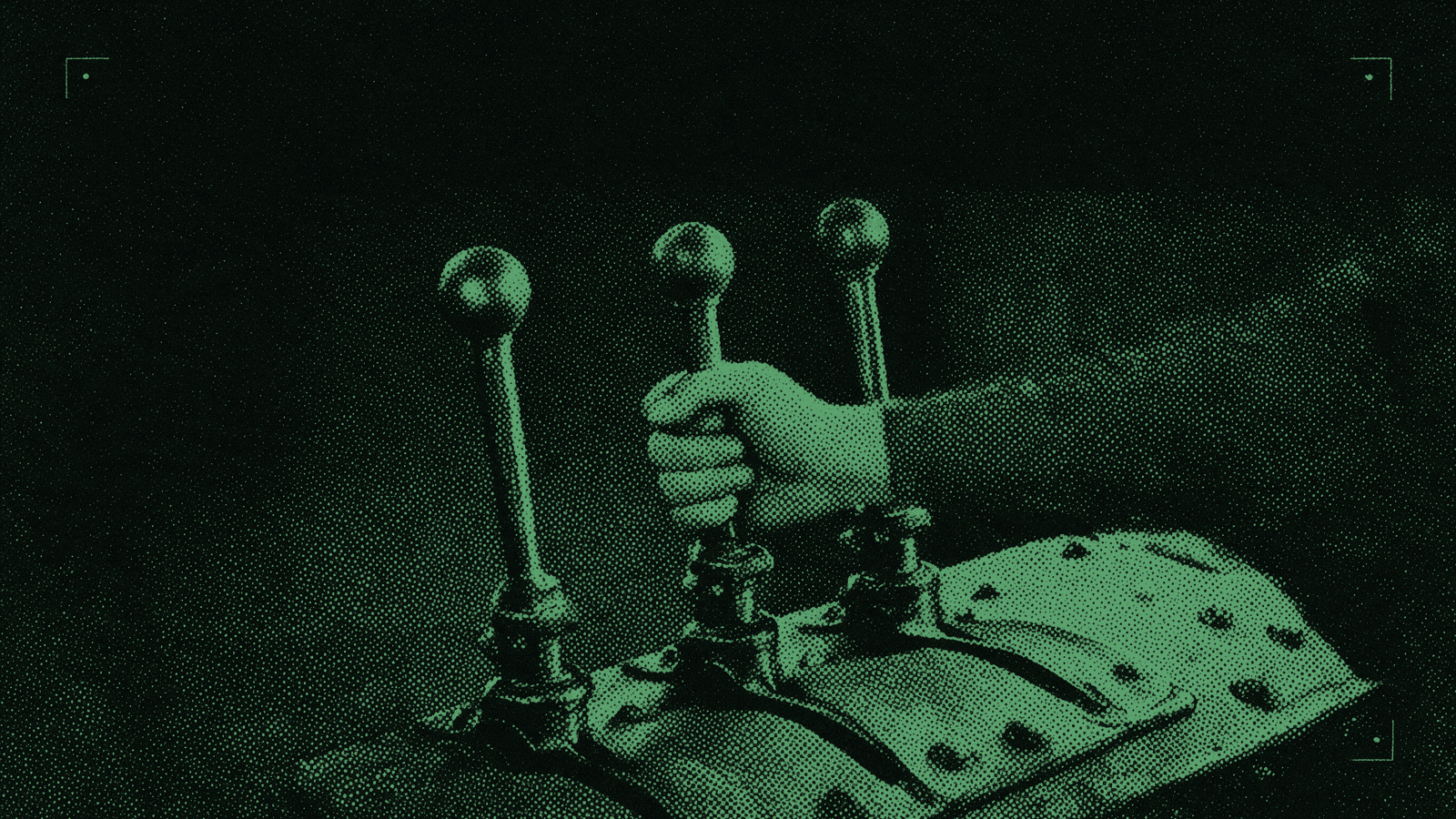 Three tall iron signal-box levers, a working hand closed around the middle one