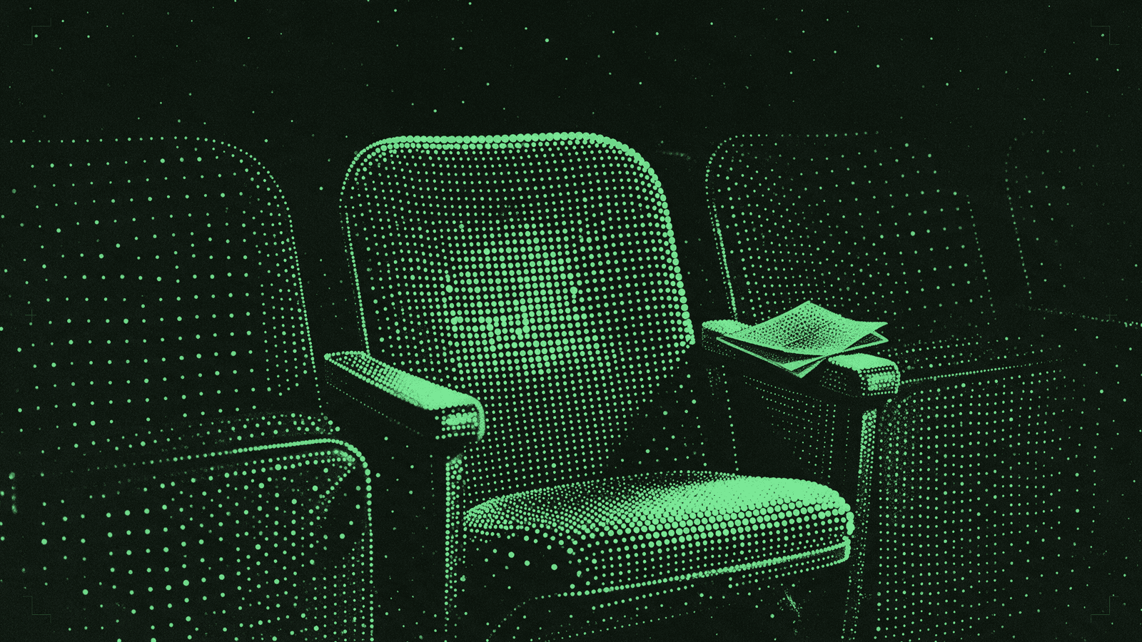 A single empty cinema seat in an otherwise dark row, a folded paper programme resting on the armrest