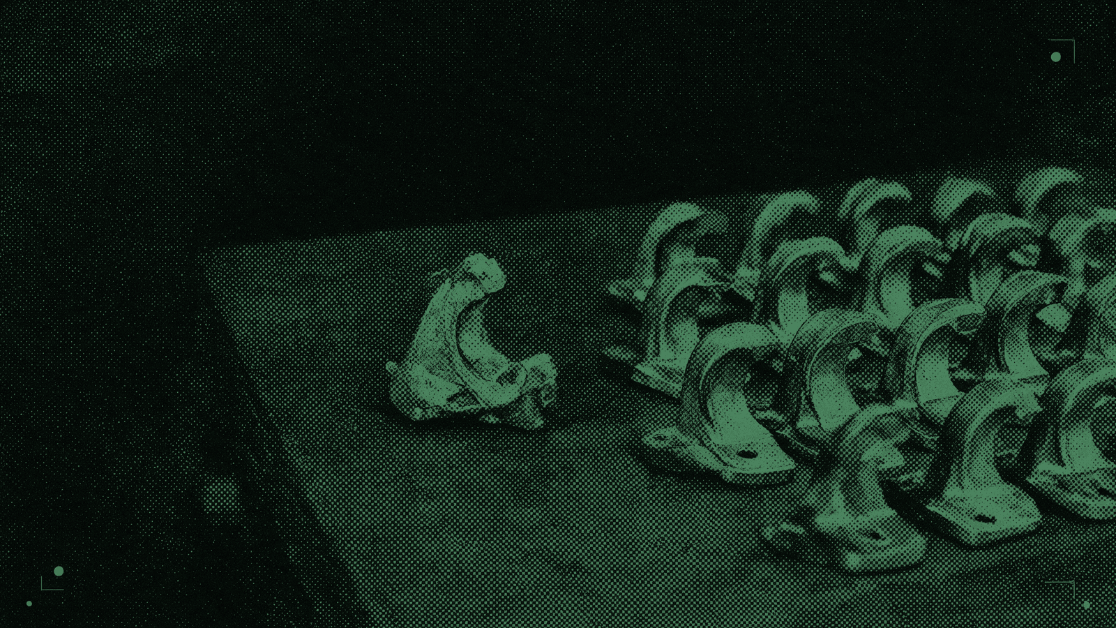A bench of identical cast parts beside one hand-cut master