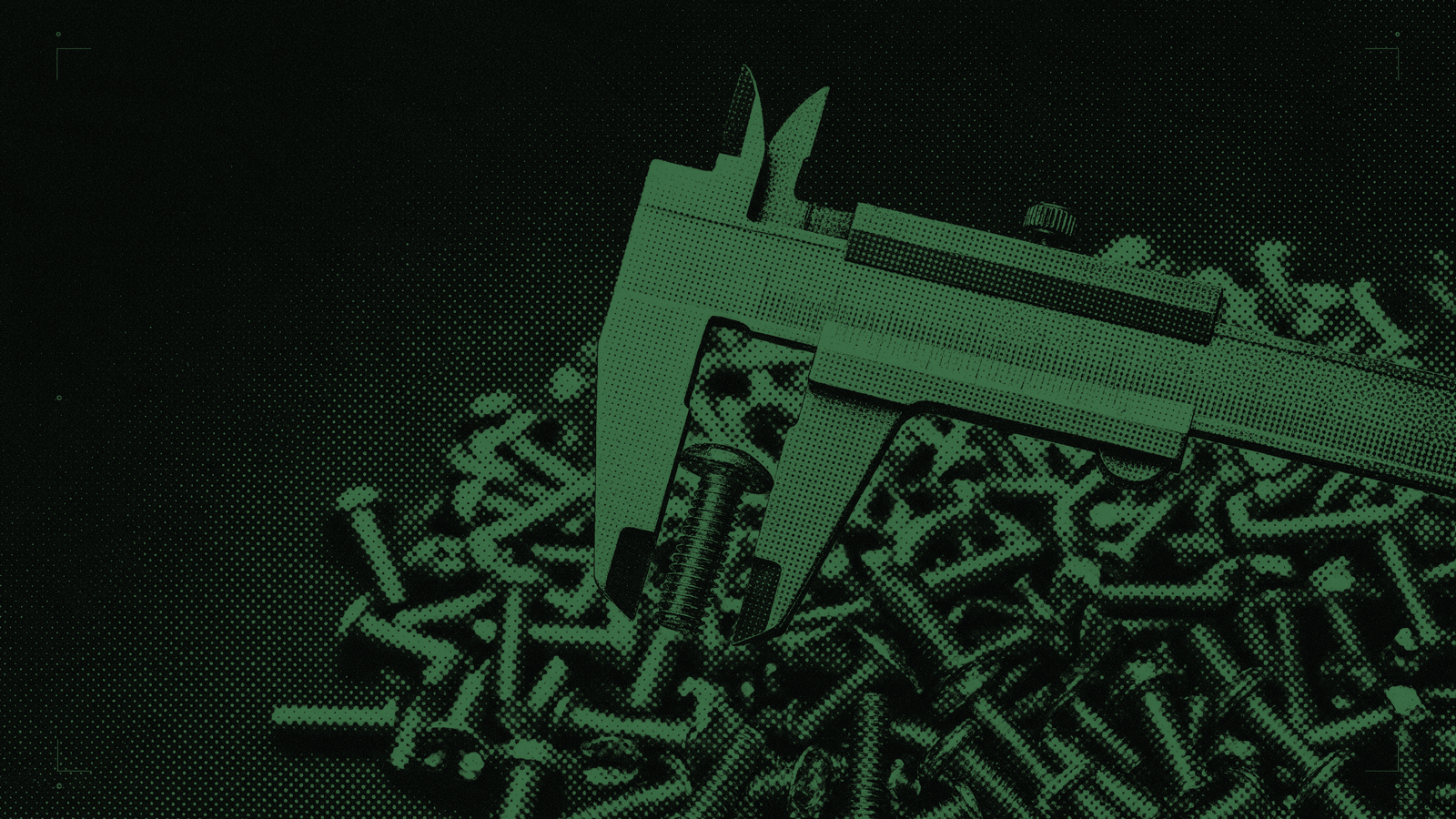 Steel calipers closed precisely around one bolt lifted clear of a scattered pile of identical bolts