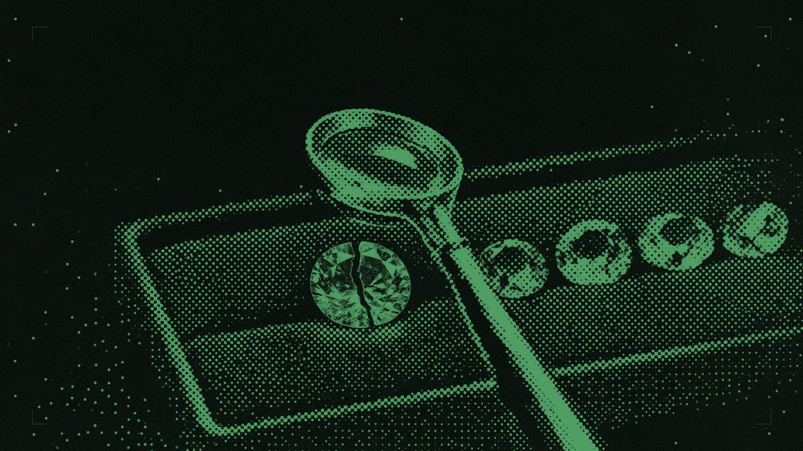 A jeweller's loupe on a felt tray beside six cut stones, the largest of them cracked clean through
