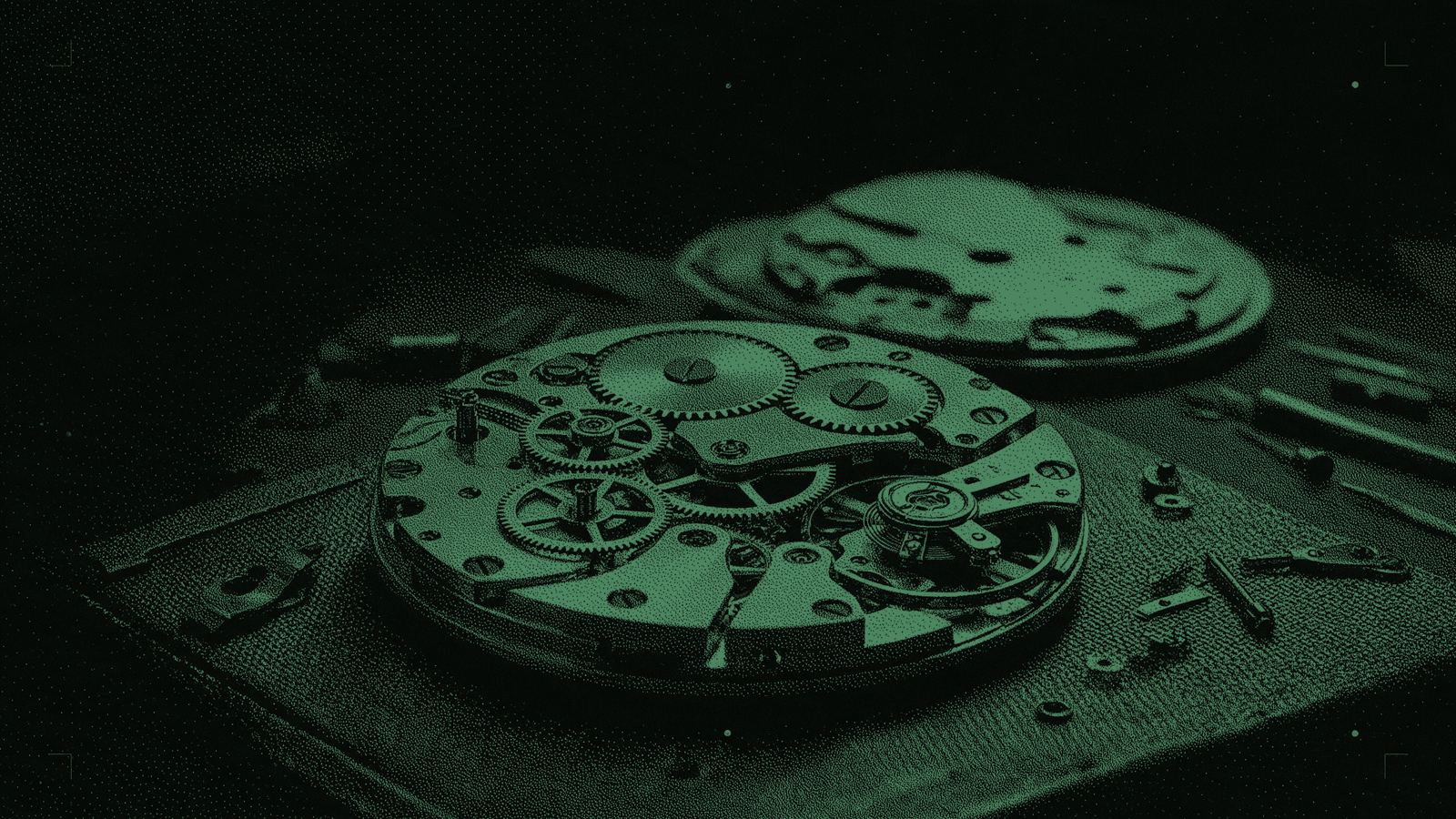 A watch movement with the dial and hands lifted away, the bare gear train still turning