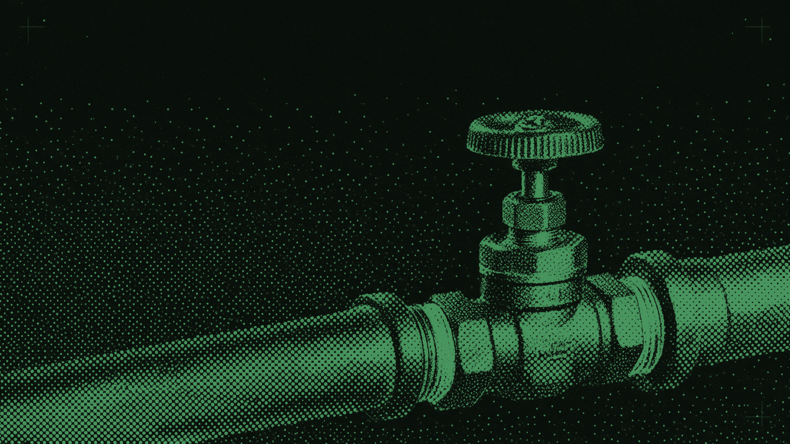 A small brass shut-off valve set into a thick industrial pipe, its handle turned a quarter