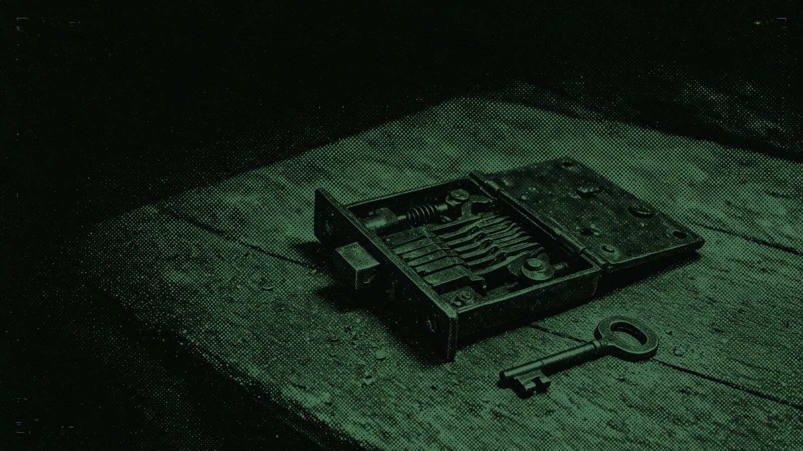 An antique lever lock lying open on a bench with its levers and bolt exposed, a worn key beside it